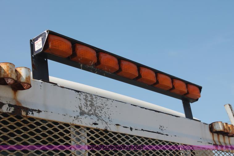 image for item I7994 1998 International 4700 low profile dump bed semi truck