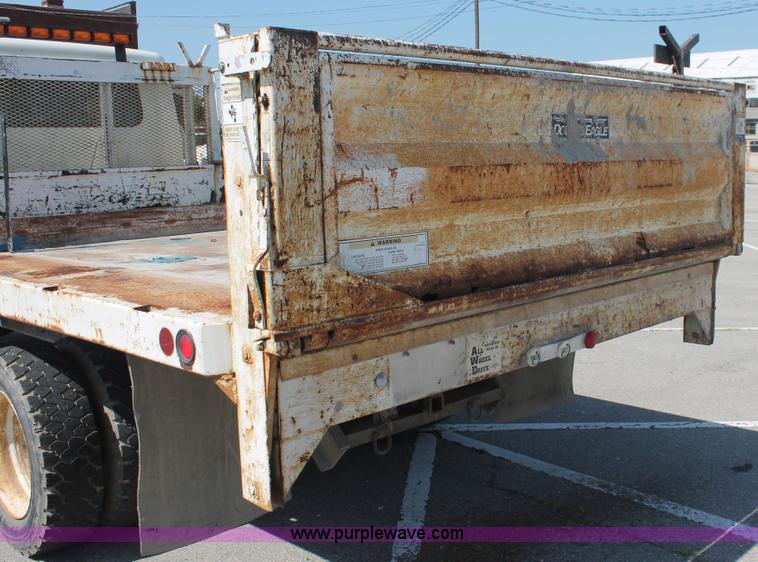 image for item I7994 1998 International 4700 low profile dump bed semi truck