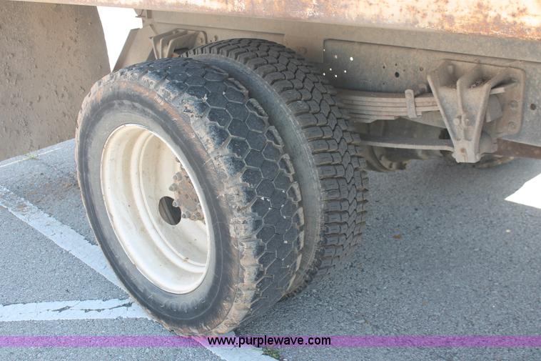 image for item I7994 1998 International 4700 low profile dump bed semi truck