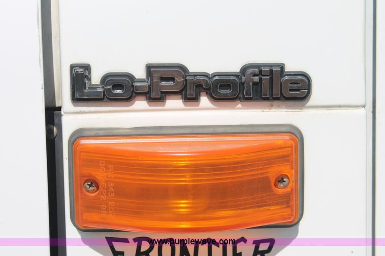 image for item I7994 1998 International 4700 low profile dump bed semi truck