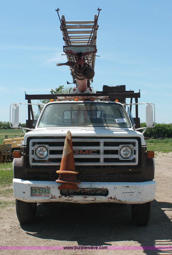 image for item H3087 1977 GMC Sierra 6500 flatbed ladder/boom truck