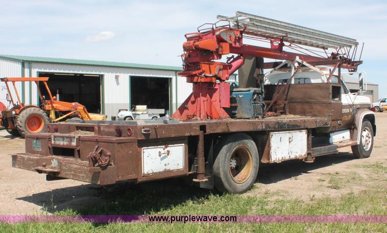 image for item H3087 1977 GMC Sierra 6500 flatbed ladder/boom truck