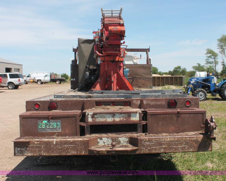 image for item H3087 1977 GMC Sierra 6500 flatbed ladder/boom truck