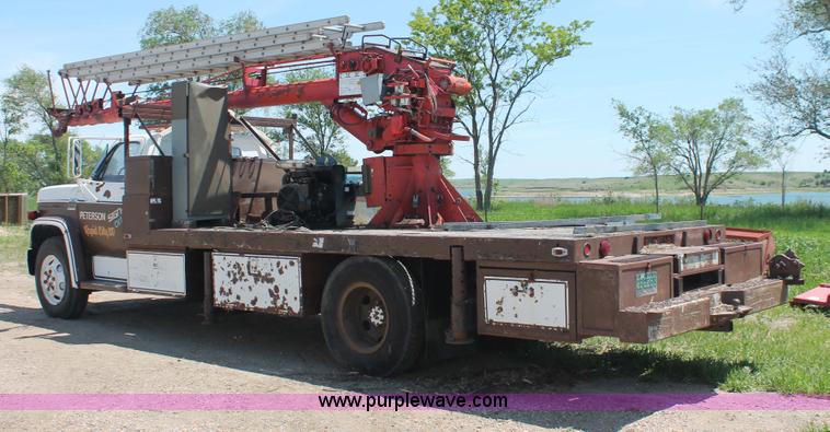 image for item H3087 1977 GMC Sierra 6500 flatbed ladder/boom truck