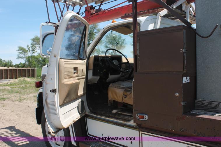 image for item H3087 1977 GMC Sierra 6500 flatbed ladder/boom truck