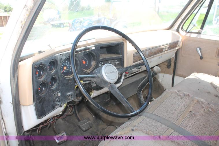 image for item H3087 1977 GMC Sierra 6500 flatbed ladder/boom truck