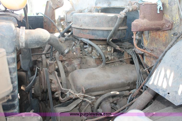 image for item H3087 1977 GMC Sierra 6500 flatbed ladder/boom truck