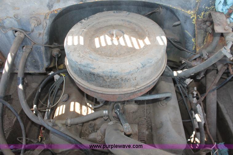 image for item H3087 1977 GMC Sierra 6500 flatbed ladder/boom truck