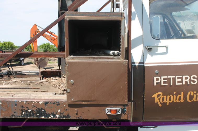 image for item H3087 1977 GMC Sierra 6500 flatbed ladder/boom truck