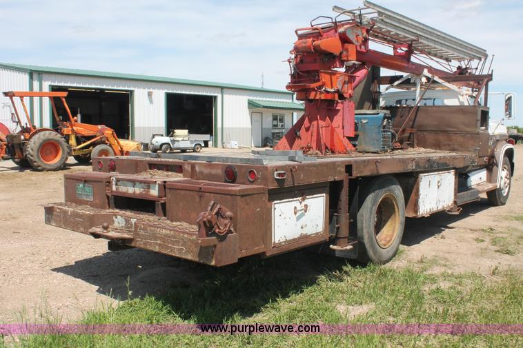 image for item H3087 1977 GMC Sierra 6500 flatbed ladder/boom truck