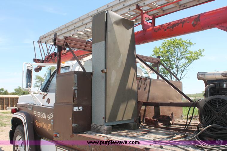 image for item H3087 1977 GMC Sierra 6500 flatbed ladder/boom truck