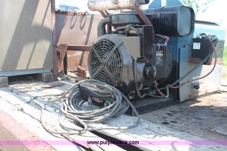 image for item H3087 1977 GMC Sierra 6500 flatbed ladder/boom truck