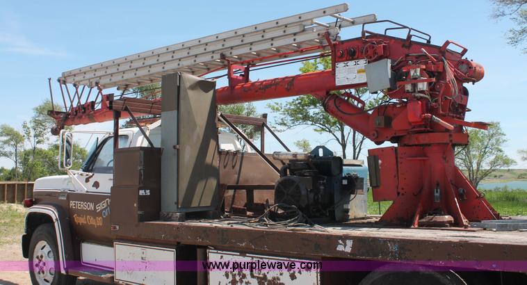 image for item H3087 1977 GMC Sierra 6500 flatbed ladder/boom truck