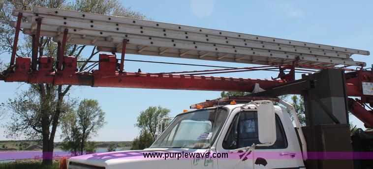 image for item H3087 1977 GMC Sierra 6500 flatbed ladder/boom truck
