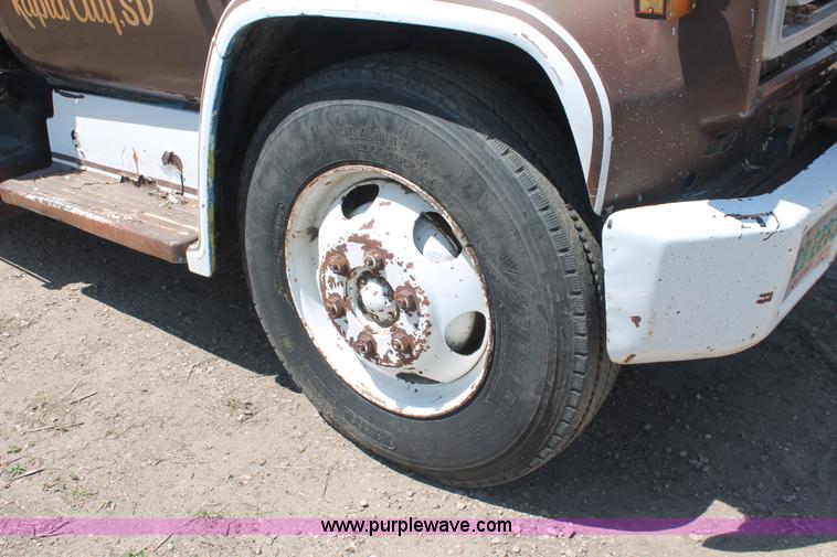 image for item H3087 1977 GMC Sierra 6500 flatbed ladder/boom truck