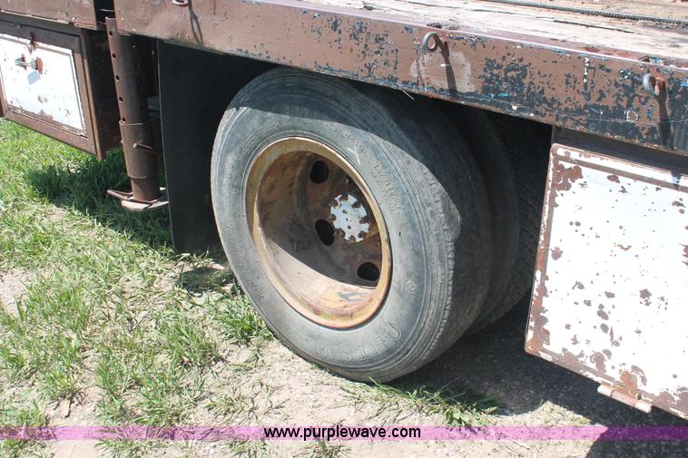 image for item H3087 1977 GMC Sierra 6500 flatbed ladder/boom truck