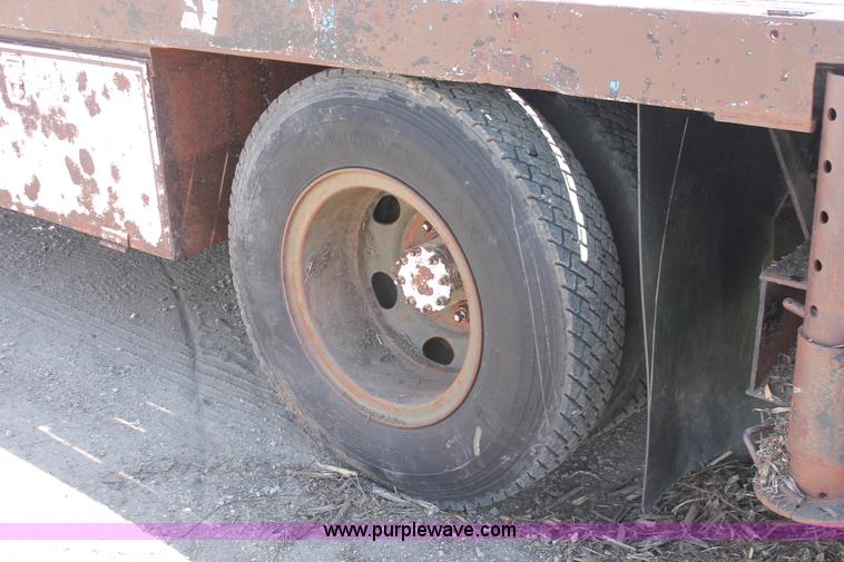 image for item H3087 1977 GMC Sierra 6500 flatbed ladder/boom truck