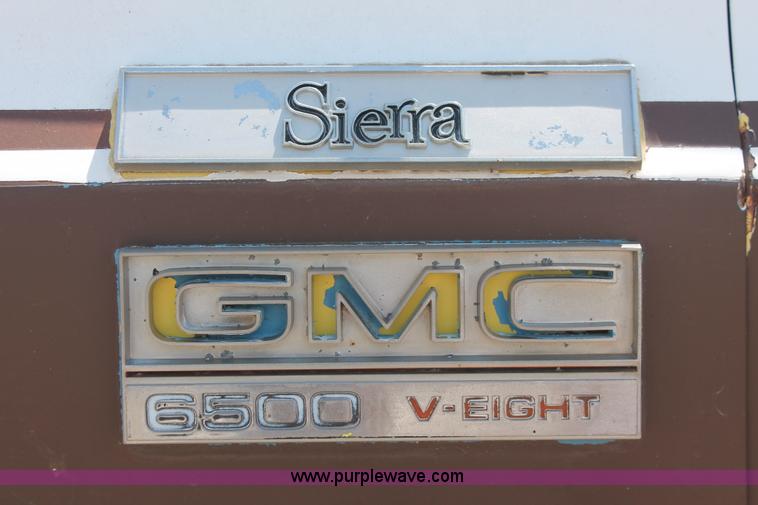 image for item H3087 1977 GMC Sierra 6500 flatbed ladder/boom truck