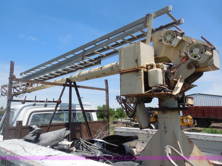 image for item H3091 1972 Ford F250 flatbed ladder/boom truck