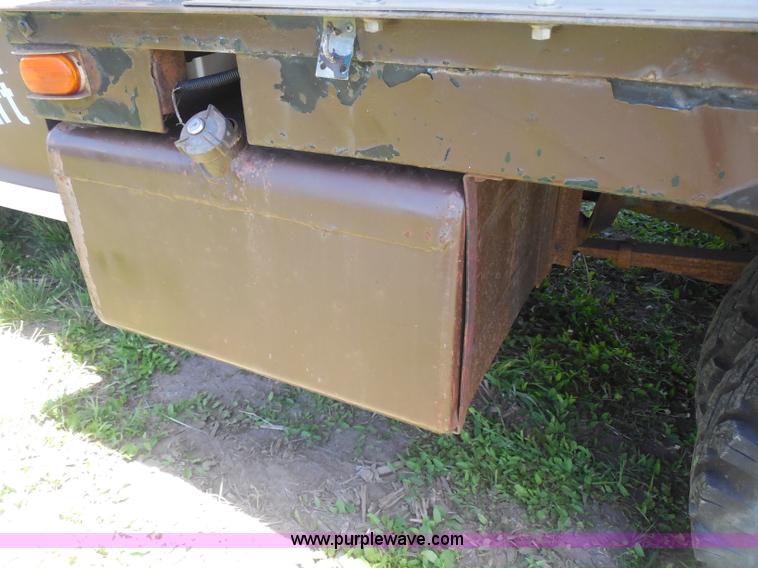 image for item H3091 1972 Ford F250 flatbed ladder/boom truck