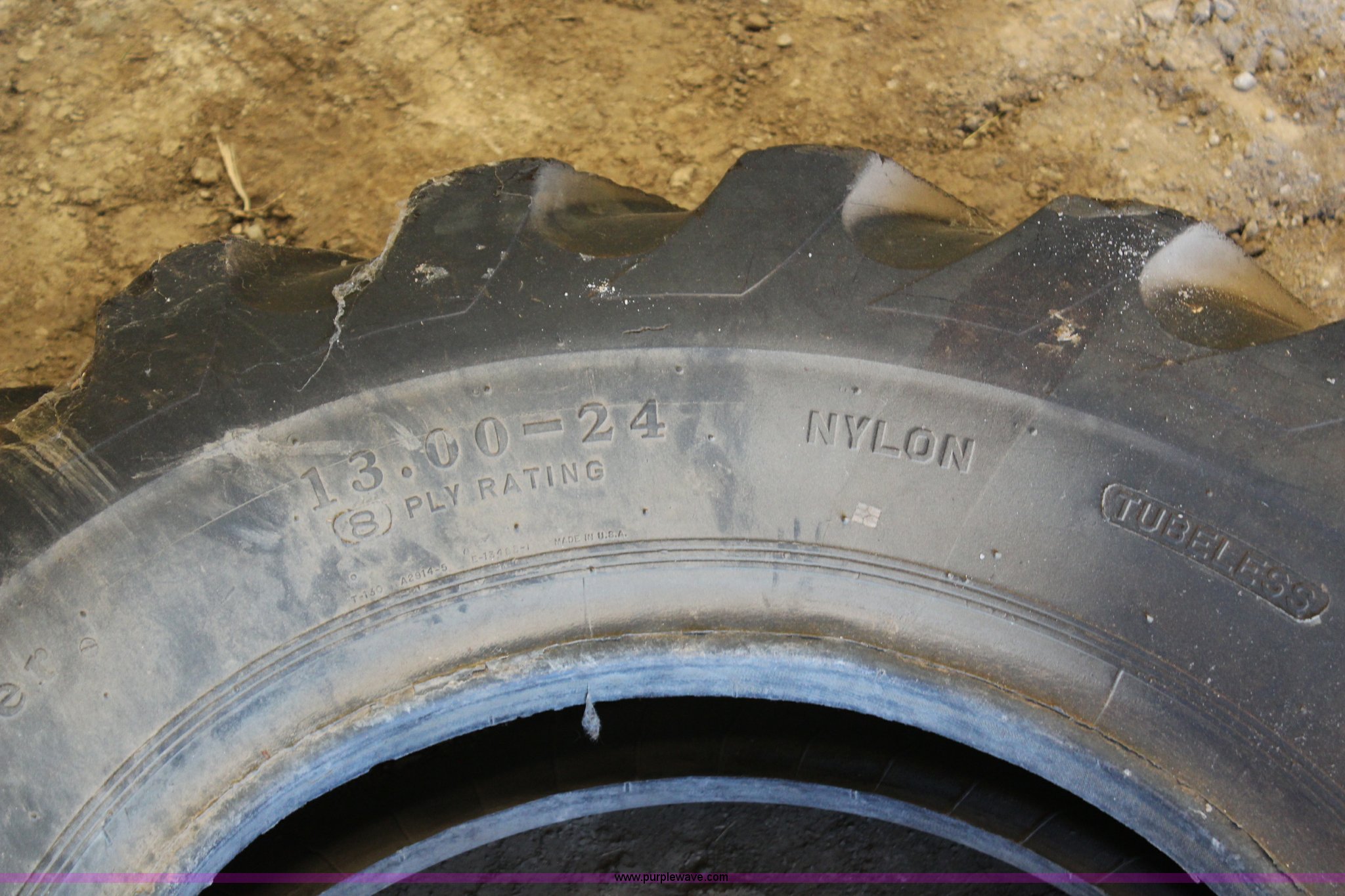 13.0024 tire in Kansas City, KS Item AU9203 sold Purple Wave
