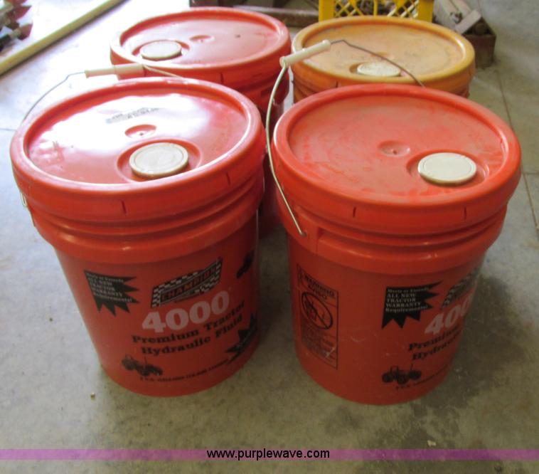 (4) fivegallon buckets of Champion 4000 hydraulic fluid in Blue