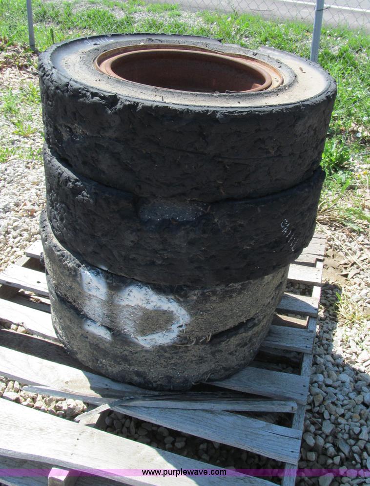 image for item F5093 (4) solid skid steer tires and wheels