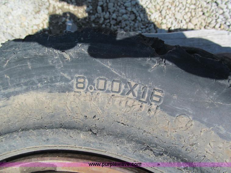 image for item F5093 (4) solid skid steer tires and wheels