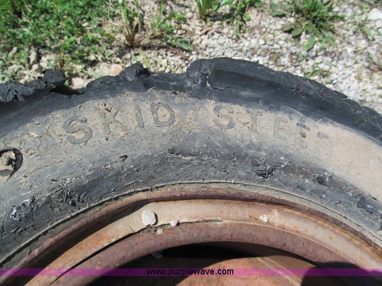 image for item F5093 (4) solid skid steer tires and wheels