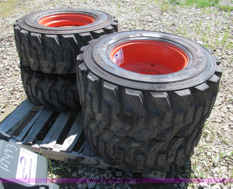 image for item F5094 (4) 12-16.5 skid steer tires and wheels