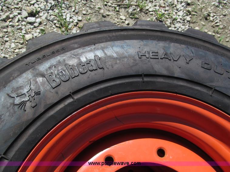 image for item F5094 (4) 12-16.5 skid steer tires and wheels