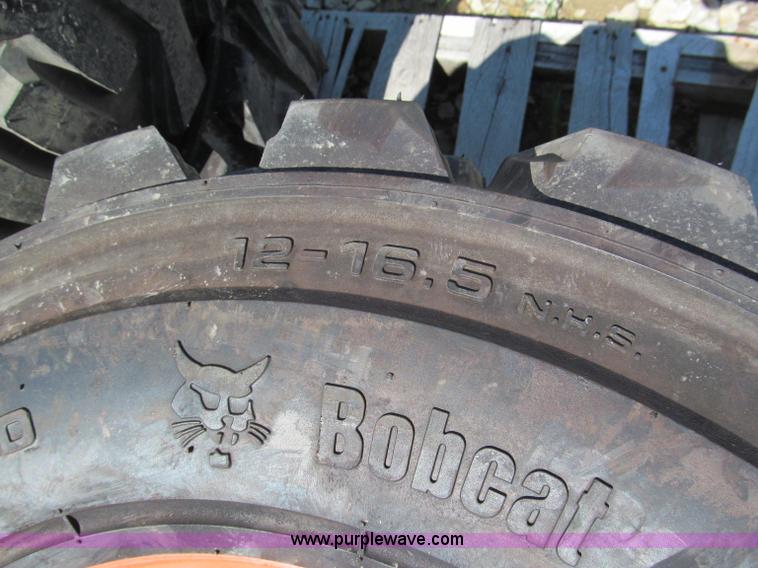 image for item F5094 (4) 12-16.5 skid steer tires and wheels