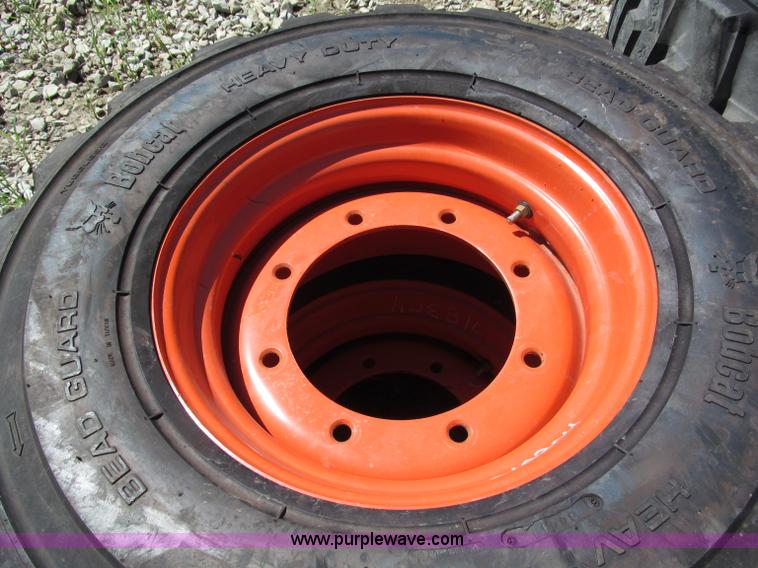 image for item F5094 (4) 12-16.5 skid steer tires and wheels