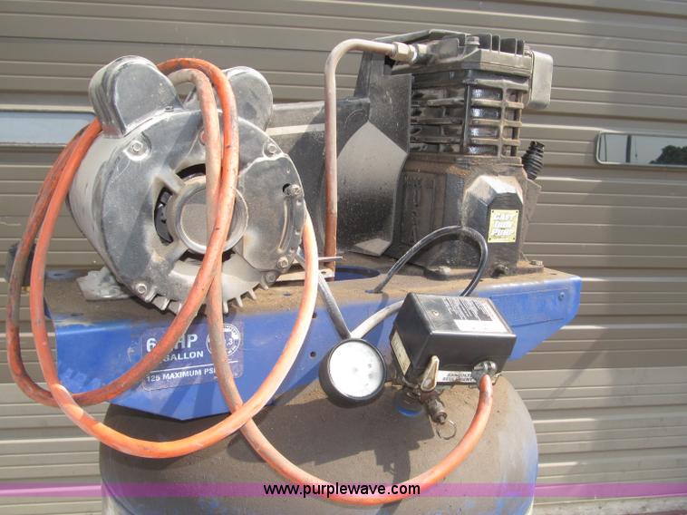 image for item K9727 1999 Campbell Hausfeld 60 gallon vertical air compressor