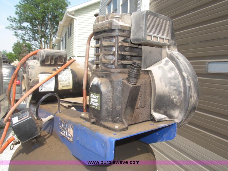 image for item K9727 1999 Campbell Hausfeld 60 gallon vertical air compressor