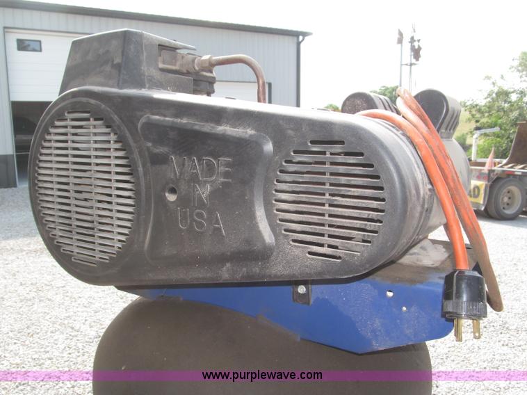 image for item K9727 1999 Campbell Hausfeld 60 gallon vertical air compressor