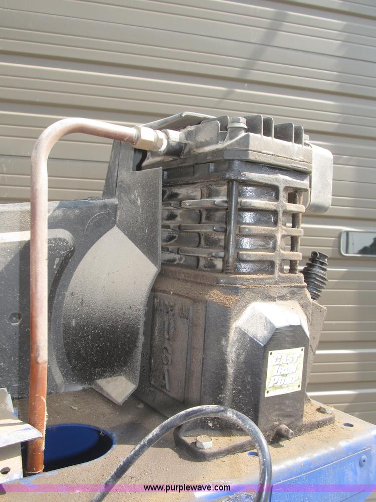 image for item K9727 1999 Campbell Hausfeld 60 gallon vertical air compressor