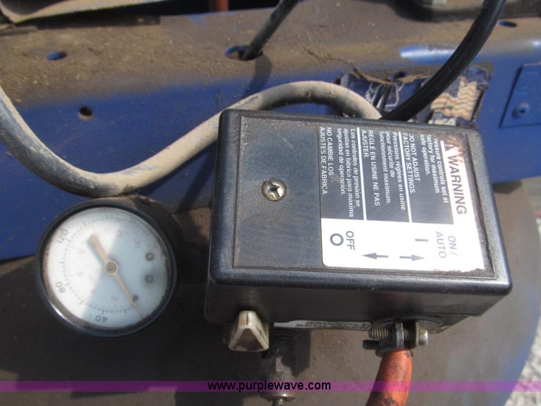 image for item K9727 1999 Campbell Hausfeld 60 gallon vertical air compressor