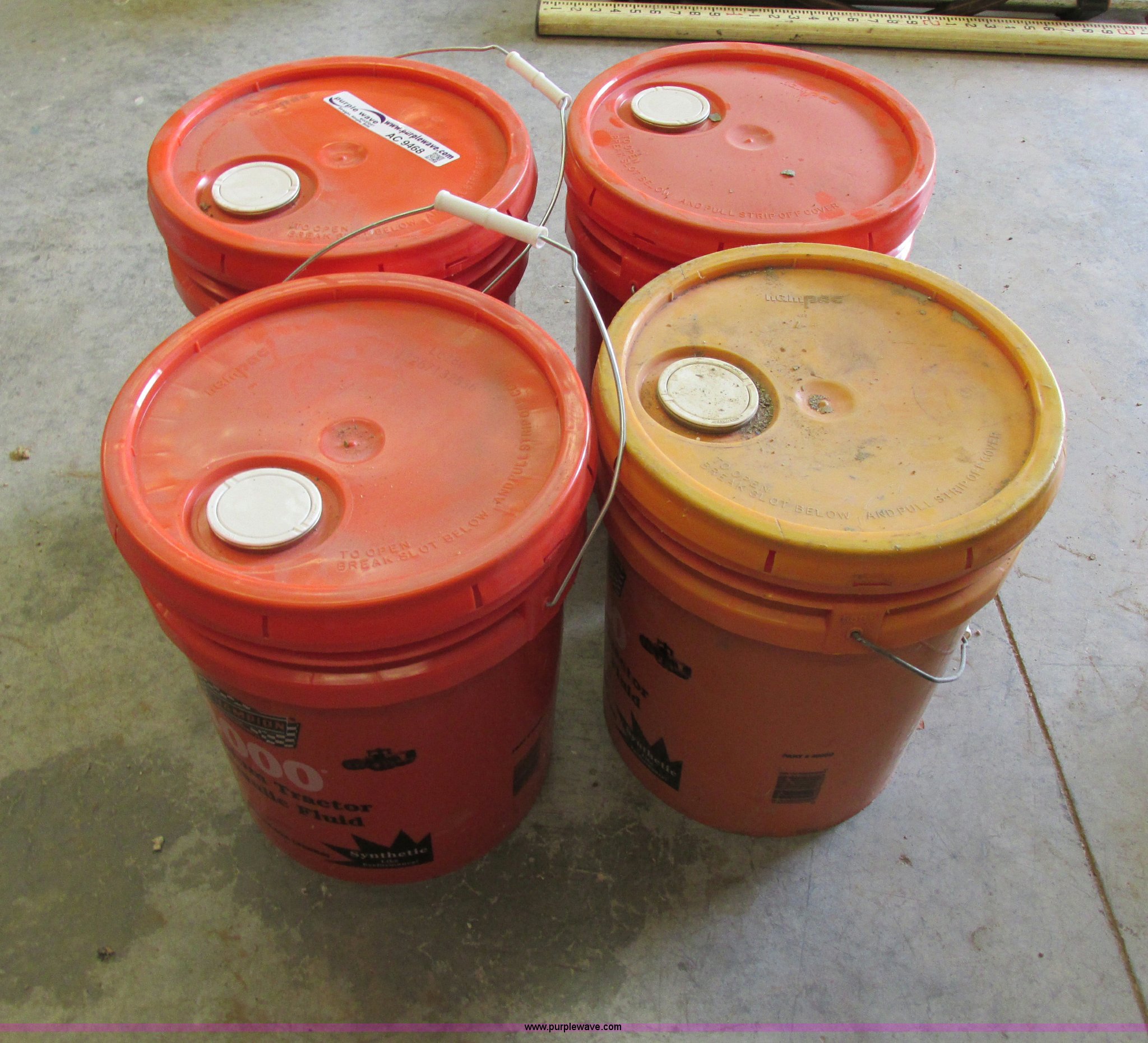 (4) fivegallon buckets of Champion 4000 hydraulic fluid in Blue