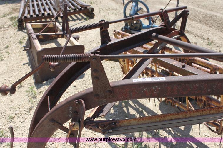 image for item AE9150 New Holland 56 side delivery rake