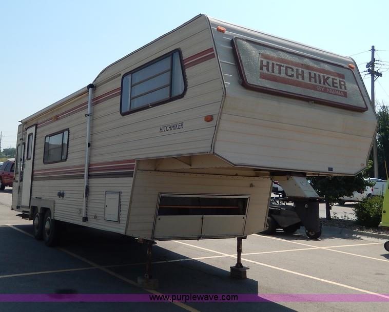 image for item I4470 1984 Nuwa Hitchhiker 28.5' fifth wheel camper