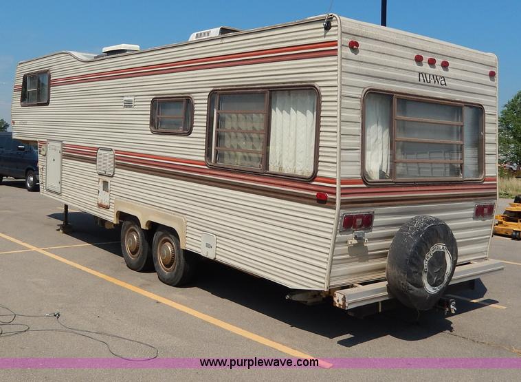 image for item I4470 1984 Nuwa Hitchhiker 28.5' fifth wheel camper