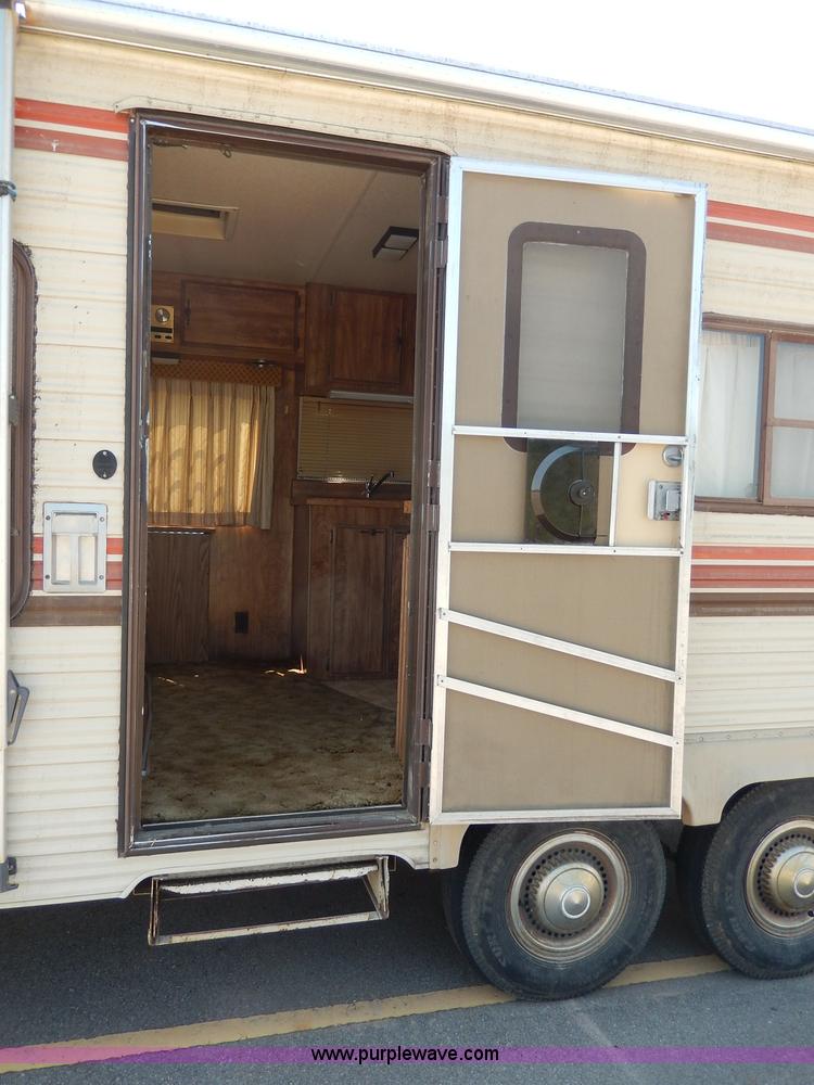 image for item I4470 1984 Nuwa Hitchhiker 28.5' fifth wheel camper