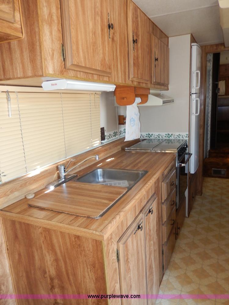 image for item I4470 1984 Nuwa Hitchhiker 28.5' fifth wheel camper