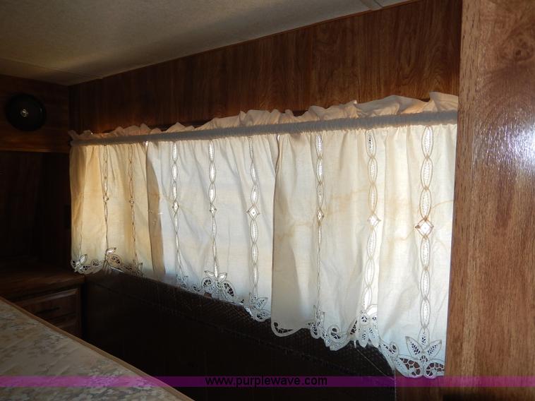 image for item I4470 1984 Nuwa Hitchhiker 28.5' fifth wheel camper