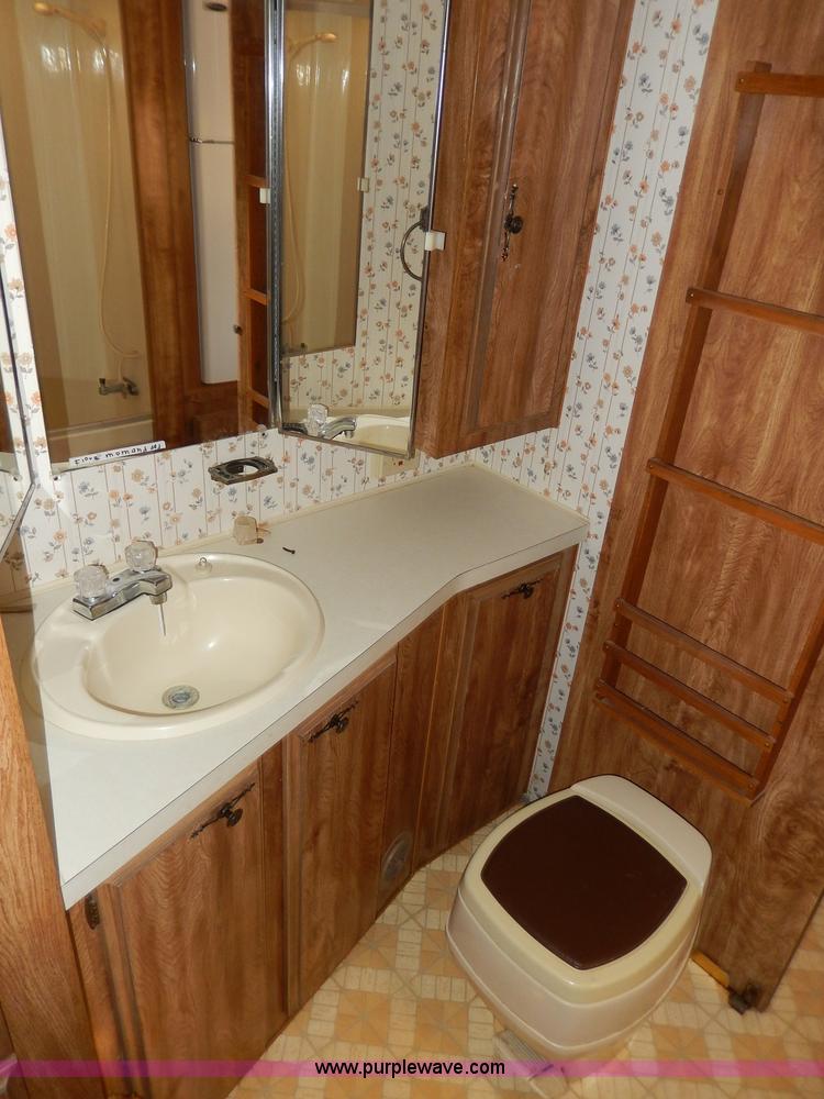 image for item I4470 1984 Nuwa Hitchhiker 28.5' fifth wheel camper