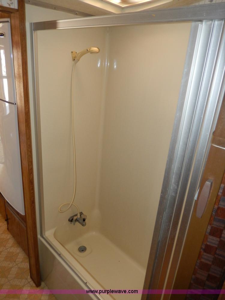 image for item I4470 1984 Nuwa Hitchhiker 28.5' fifth wheel camper