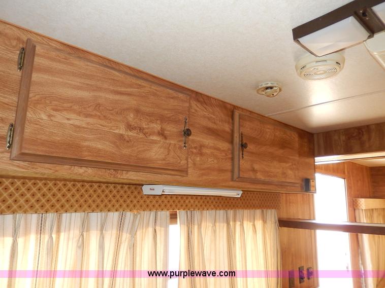 image for item I4470 1984 Nuwa Hitchhiker 28.5' fifth wheel camper