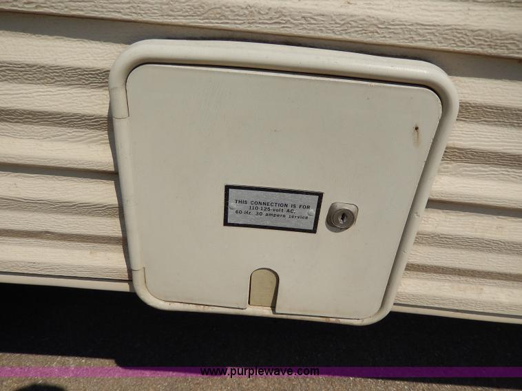 image for item I4470 1984 Nuwa Hitchhiker 28.5' fifth wheel camper