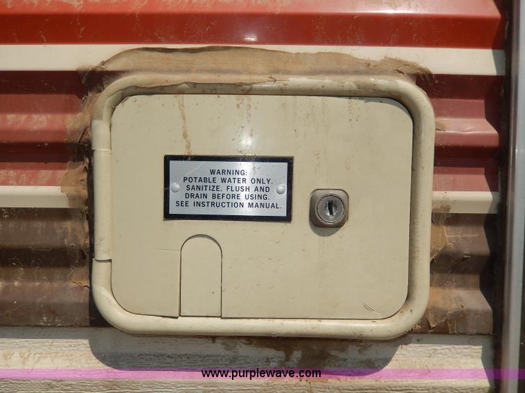 image for item I4470 1984 Nuwa Hitchhiker 28.5' fifth wheel camper